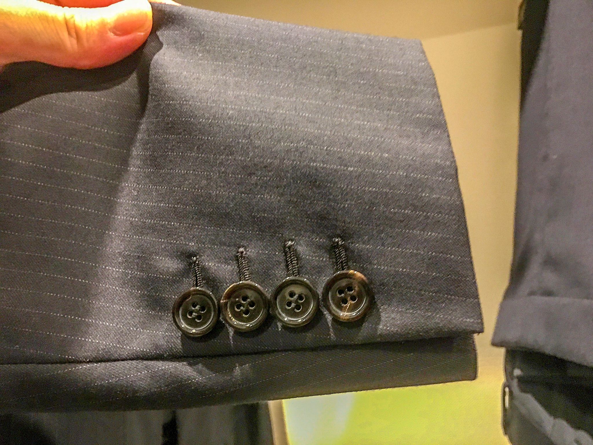 Buttons on pinstripe suit